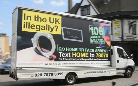 Mobile billboards warning illegal immigrants to "go home or face arrest".