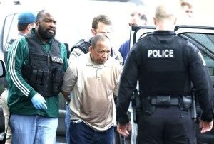 Police take Eulalio Tordil, 62, a suspect in three fatal shootings in the Washington, D.C., area into custody in Bethesda, Md., Friday, May 6, 2016. Tordil is an employee of the Federal Protective Service, which provides security at federal properties. He was put on administrative duties in March after a protective order was issued against him.