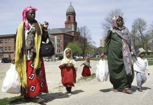 Somali women and their children walk through downtown Lewiston, Maine, Tuesday, in a May 8, 2007, photo. Over the past six years, as many as 3,500 black refugees from the wartorn African country have settled in this nearly all-white, heavily French-Canadian and largely Roman Catholic city of 36,000, giving Lewiston the highest concentration of Somalis anywhere in America."Their children are the only assets they have. They left everything else in Somalia," said Said Mohamud, manager of the Mogadishu Store. 