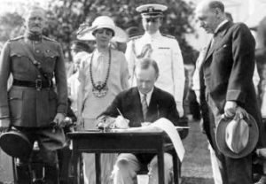 Coolidge siging Johnson-Reed Act