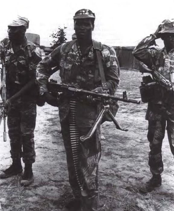 RAR troops with Belgian FAL ifles  and MAG-58 machine gun